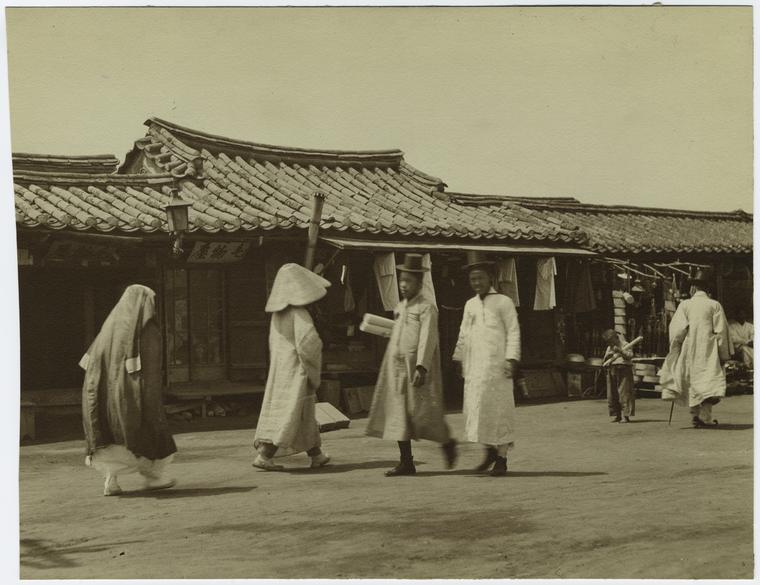 Koreans walking down street